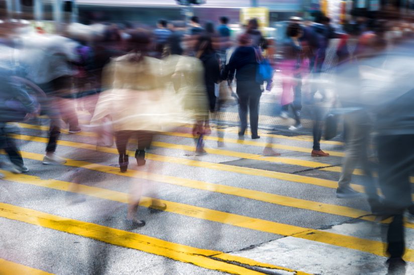 Conceptual motion blur picture of people crossing the street in a big city