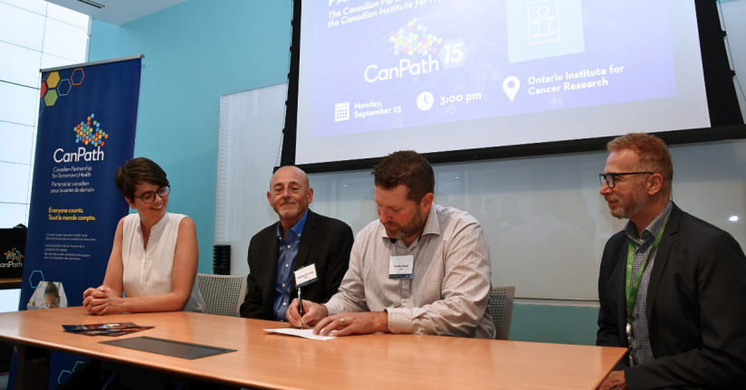 Jennifer Brooks, Steve O'Reilly, Jordan Hunt, and Philip Awadalla sign a commemorative partnership document.