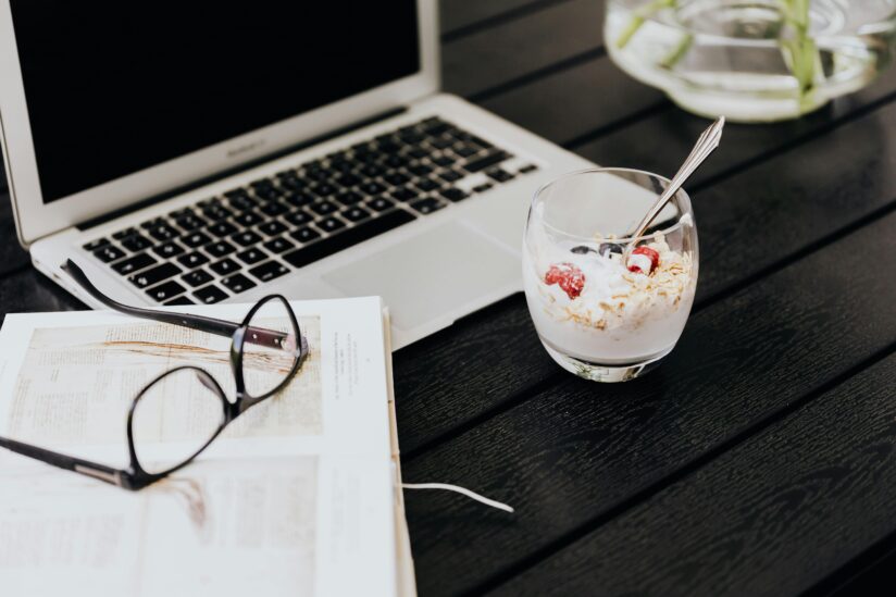 Muesli bowl in front of a laptop on a desk